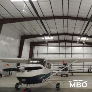 aircraft stored in an insulated rigid framed hangar