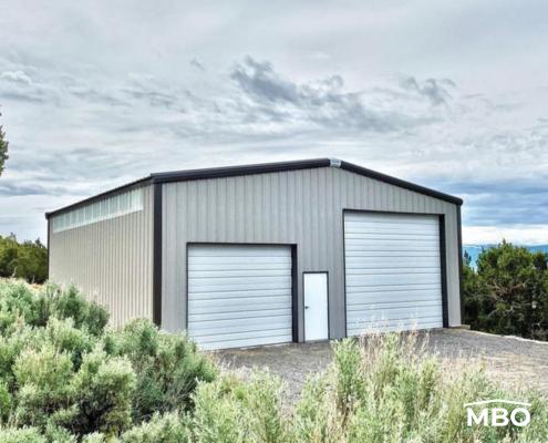 Grey Metal Garage Surrounded by Greenery