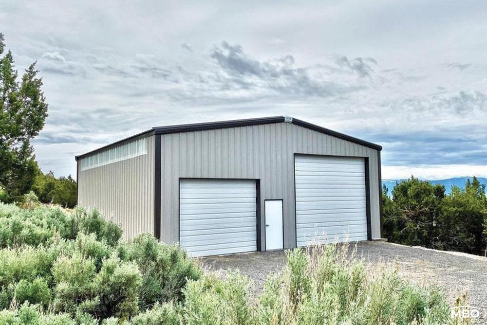 Grey Metal Garage Surrounded by Greenery