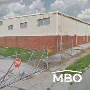 Metal Building with Brick Siding on the Lower Half